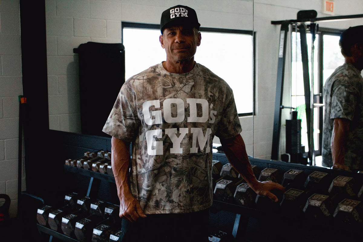 God's Gym Faded Camo Tee at the dumbbell rack