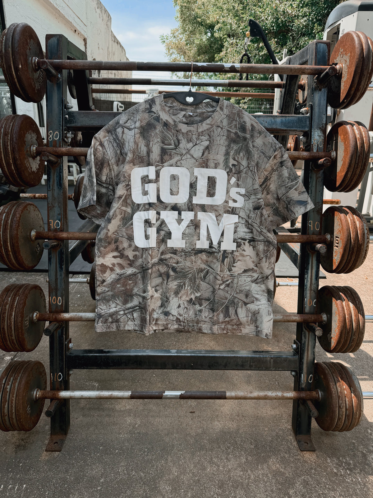 God's Gym Faded Camo Tee on an outdoor barbell rack