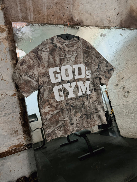 God's Gym Faded Camo Tee hanging on a gym mirror