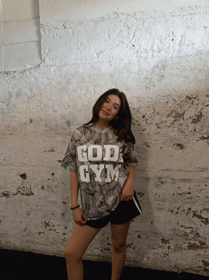 Woman wearing the God's Gym Faded Camo Tee